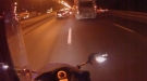 Biker Gets Pulled Under Massive Truck
