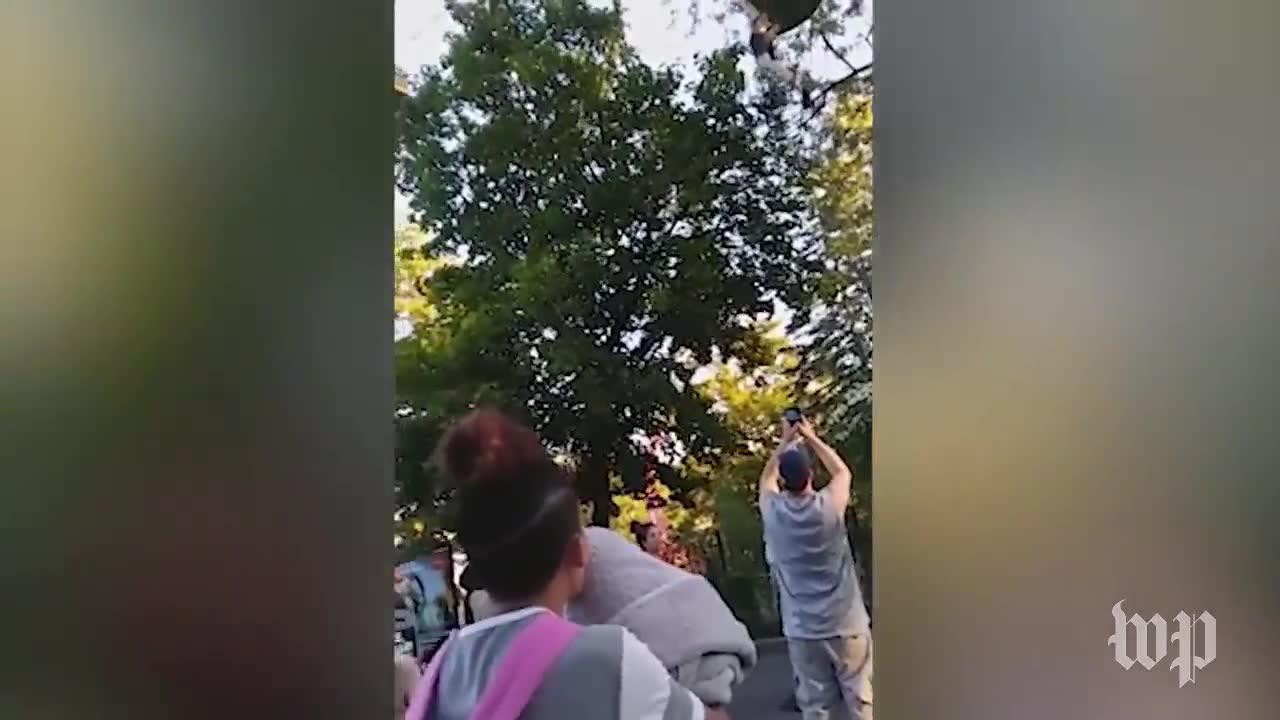 Teen dangles from Six Flags ride as crowd gathers to catch her